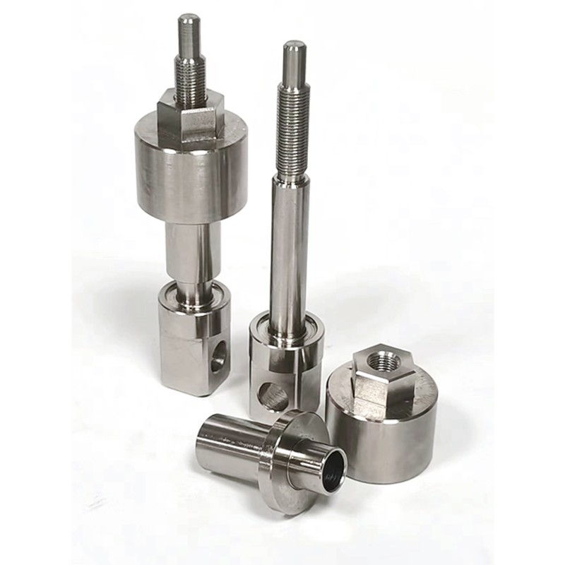 Turned spindles with locking nut and sleeve